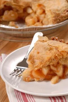 Slice of deep dish apple pie Stock Photos