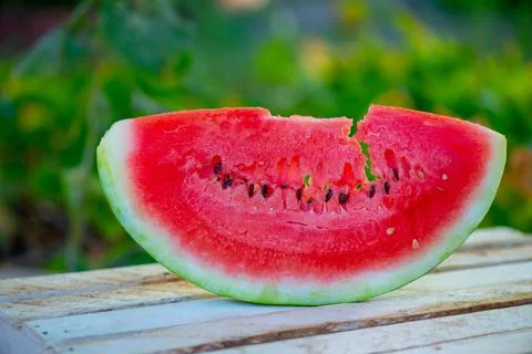 A slice of delicious watermelon is on the table Stock Photos