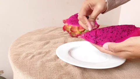 A slice of dragon fruit on a table Stock Footage 146253422