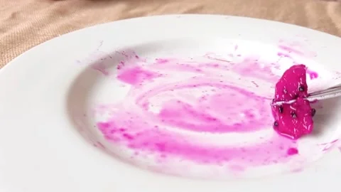 A slice of dragon fruit on a white plate Stock Footage 146253427