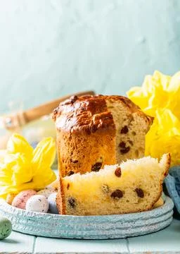 Slice of easter orthodox sweet bread, kulich end quail eggs. Stock Photos