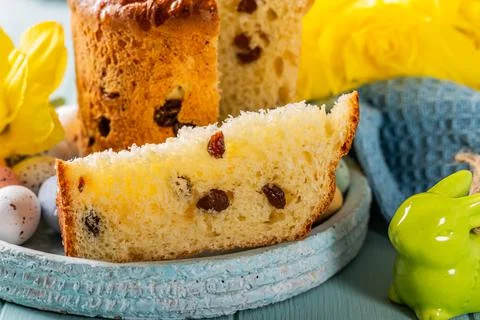 Slice of easter orthodox sweet bread, kulich end quail eggs. Stock Photos