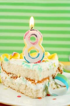 Slice of eighth birthday cake Stock Photos