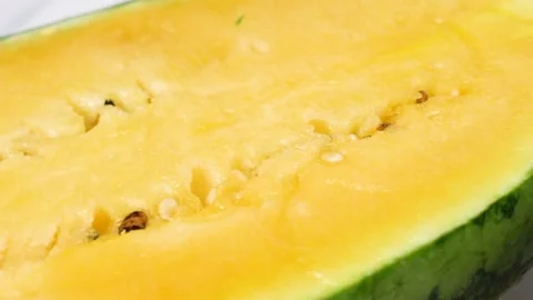 Slice of Exotic Yellow watermelon Stock Footage 156796625