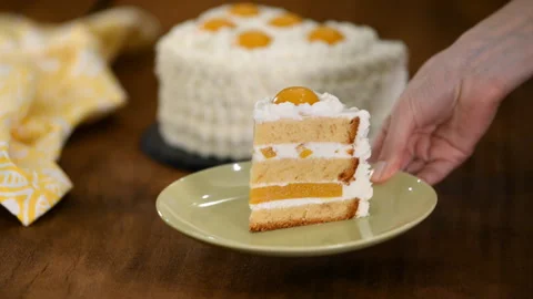 Slice of fresh cake with peach and cheesy cream. Stock Footage 121787273