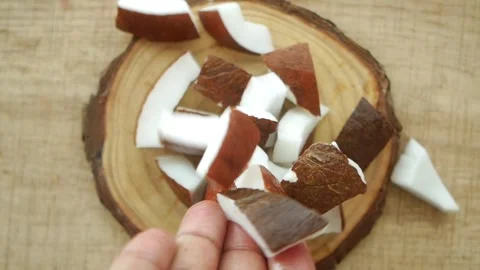 Slice of fresh coconut dropping on table Stock Footage 280734701