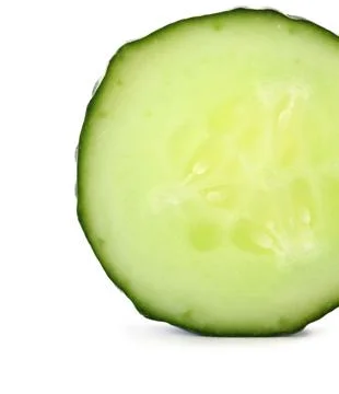 Slice of fresh cucumber on white background Stock Photos