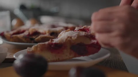 Slice of fresh fruit pie golden crust, plums Ready plum pie. Female baker pl Stock Footage 250527426