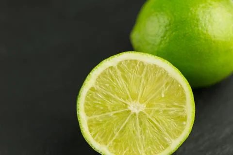 Slice of fresh lime fruit Stock Photos