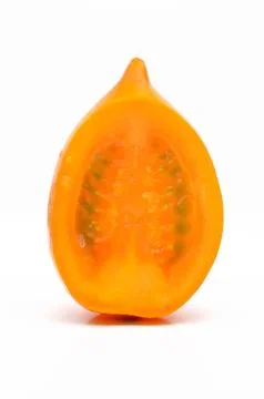 Slice of fresh orange tomato Stock Photos