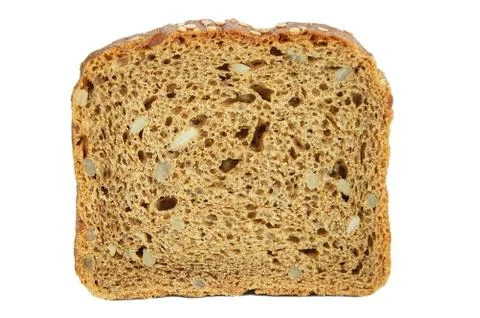 A slice of fresh rye bread with slices of sunflower seeds. White isolate. Clo Stock Photos