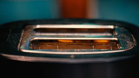 Slice of fresh toasted bread jumping out of the toaster. Stock Footage 121643070