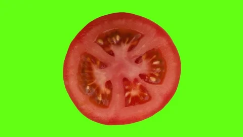 Slice of fresh tomato rotating on the green screen Stock Footage 280222187