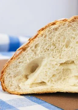 A slice of fresh white crunchy bread. Close-up Stock Photos