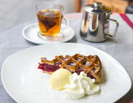 Slice of fruit tart and tea Stock Photos