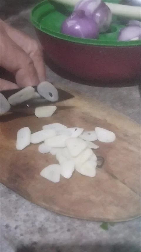 Slice garlic on a cutting board Stock Footage 290984812