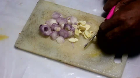 Slice the garlic into small pieces Stock Footage 148983855