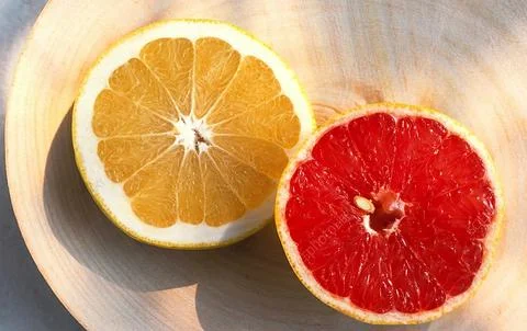 Slice of grapefruit citrus fruit Stock Photos