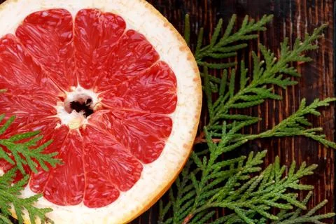 A Slice of Grapefruit on a Pink Background Stock Photos
