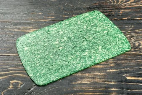 Slice of green cheese Foto stock