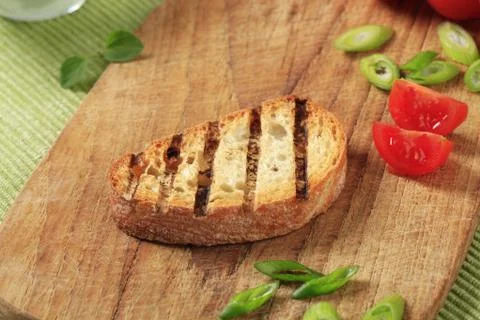 Slice of grill toasted bread on a cutting board Stock Photos