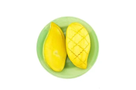 Slice half ripe mango isolated Stock Photos