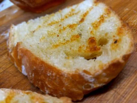 Slice of homemade bread cut and toasted 스톡 사진