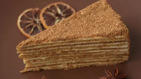 A slice of honey puff cake or pumpkin, carrot and cream pie, vegan sweets Stock Footage 308965186