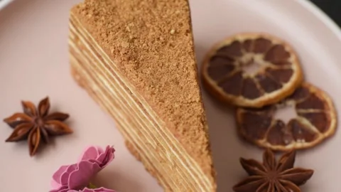A slice of honey puff cake or pumpkin, carrot and cream pie, vegan sweets Stock Footage 308965211