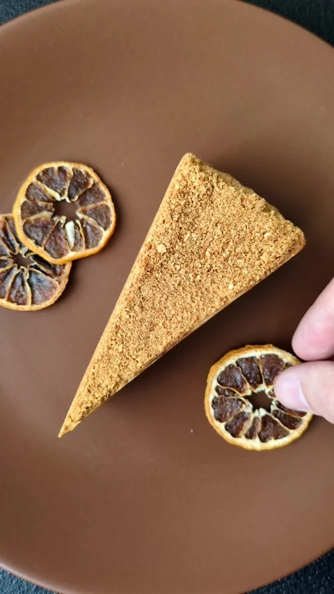 A slice of honey puff cake or pumpkin, carrot and cream pie, vegan sweets Stock Footage 308965287