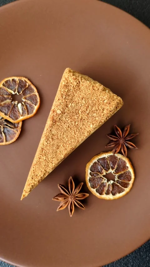 A slice of honey puff cake or pumpkin, carrot and cream pie, vegan sweets Stock Footage 308965295