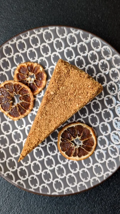 A slice of honey puff cake or pumpkin, carrot and cream pie, vegan sweets Stock Footage 308965302