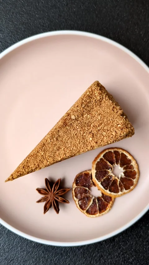 A slice of honey puff cake or pumpkin, carrot and cream pie, vegan sweets Stock Footage 308965317