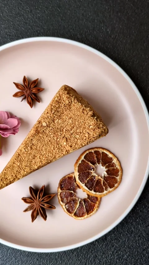 A slice of honey puff cake or pumpkin, carrot and cream pie, vegan sweets Stock Footage 308965323