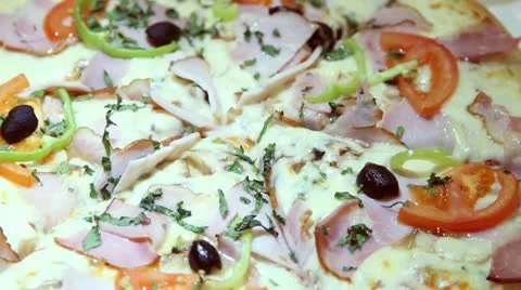 A slice of hot, fresh pizza being served.  Stock Footage 19279438