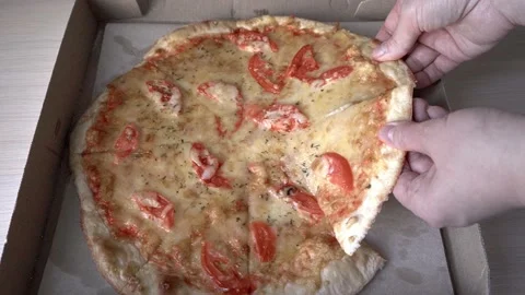 Slice of hot pepperoni pizza. Human hand taking pieces slices of hot tasty i Vidéo 200249081