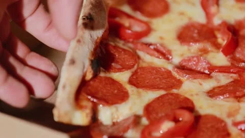 Slice of hot pepperoni pizza. Taking pieces slices of hot tasty italian pizza Stock Footage 134681697