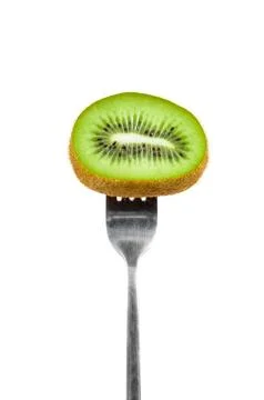 Slice of kiwi on a fork Stock Photos