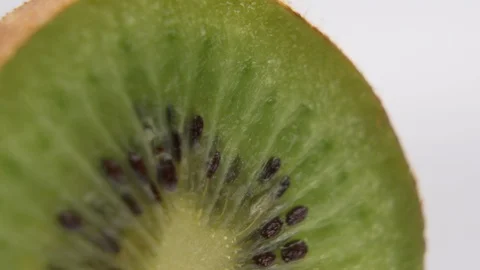 Slice of kiwi fruit isolated on white background Stock Footage 126636608
