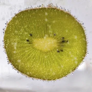 Slice of kiwi Stock Photos