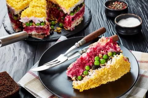 A slice of layered cake salad, close-up Stock Photos