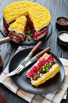 A slice of layered cake salad, top view Stock Photos