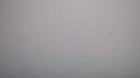 A slice of lemon and lime falling into the water Stock Footage 124519769