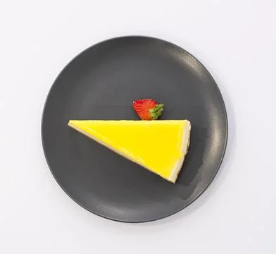 A slice of lemon cheesecake Stock Photos