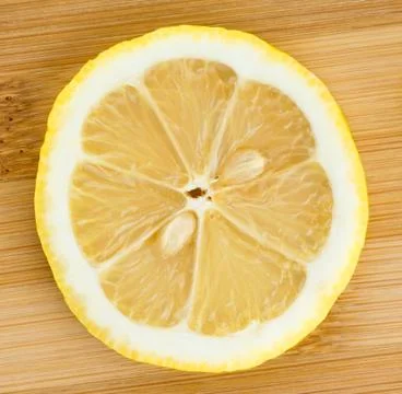 Slice of lemon closeup Stock Photos