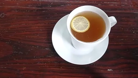 A slice of lemon on a hot lemon tea Stock Footage 150215711