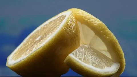 A slice of lemon, lies exposed. The flesh with refreshing juice. Comestible. Stock Photos