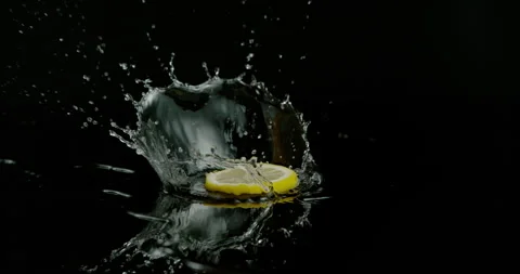 Slice of Lemon splashes on black background 스톡 동영상 249562297