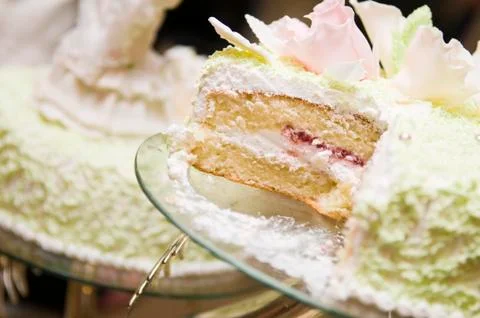 Slice of light wedding cake Stock Photos