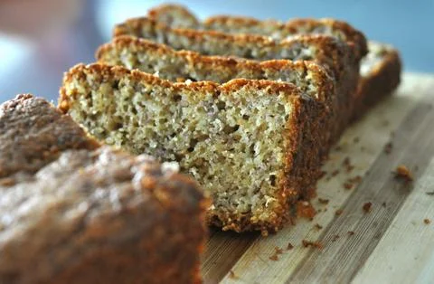 Slice of  loaf of artisan bread  on a handcrafted plate Stock Photos